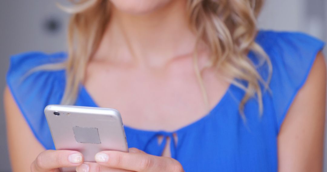 Woman with Blonde Hair Texting on Smartphone  - Free Images, Stock Photos and Pictures on Pikwizard.com