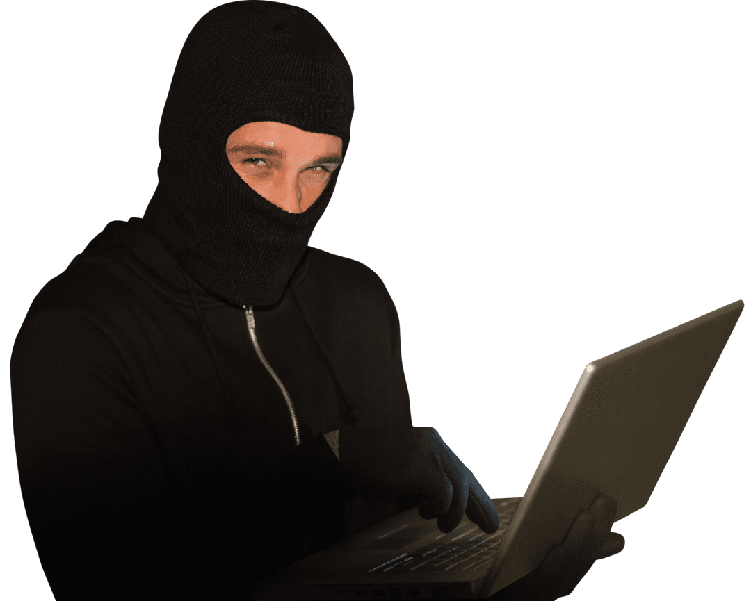 Cybercriminal in Mask Using Laptop with Network Security Threat