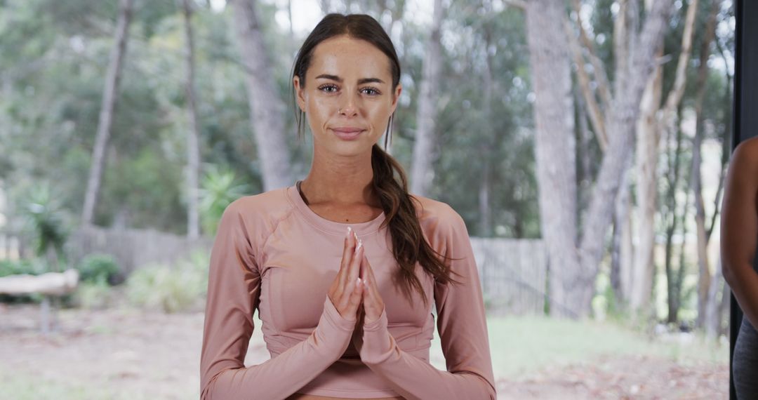 Smiling Woman Meditating in Forested Outdoor Setting - Free Images, Stock Photos and Pictures on Pikwizard.com