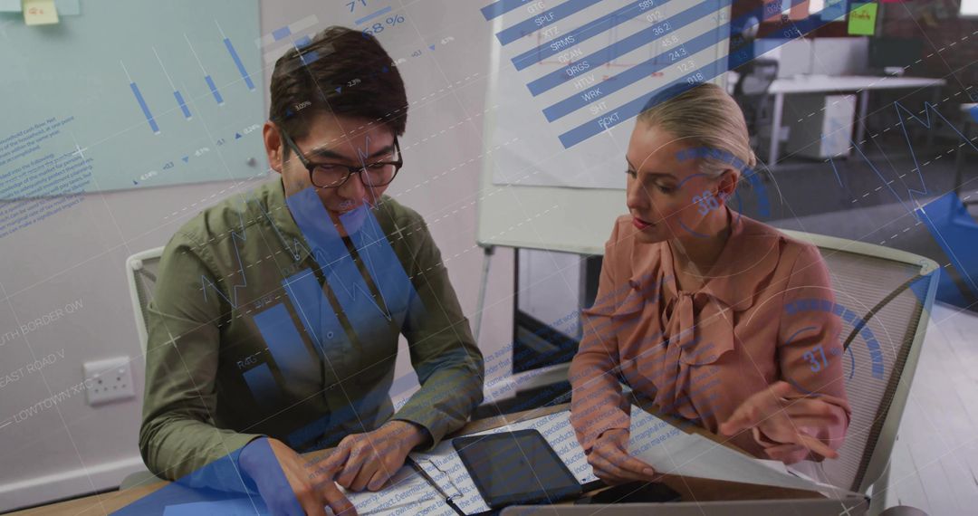 Colleagues Collaborating on Business Strategy Analysis Charts