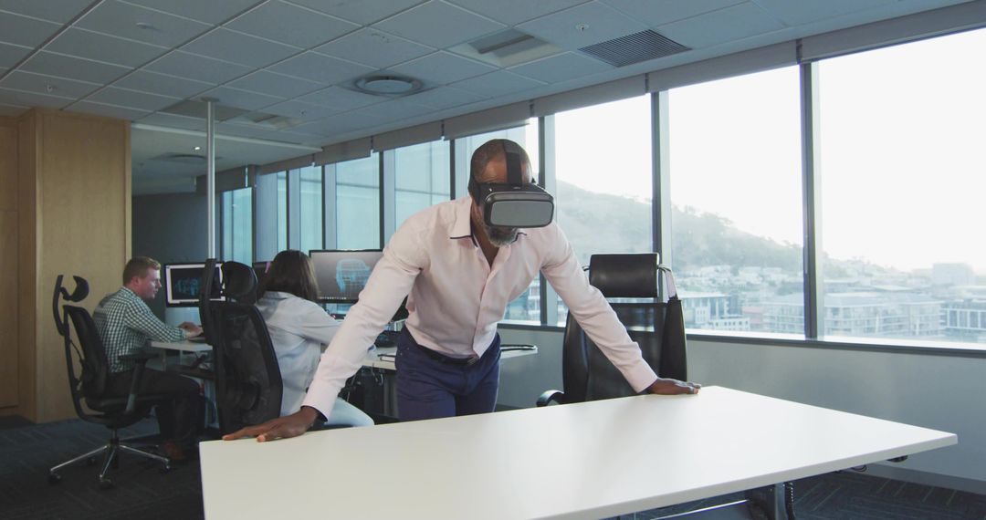 Professional Black Male Utilizing VR Headset in Modern Office Environment
