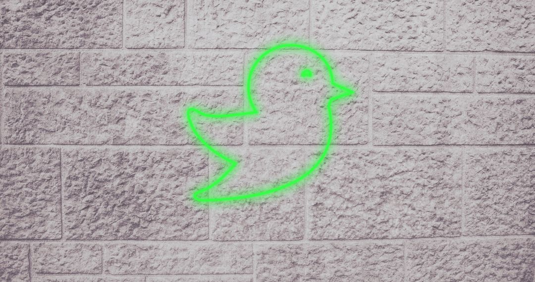 Neon Green Bird Icon on Gray Brick Wall - Free Images, Stock Photos and Pictures on Pikwizard.com