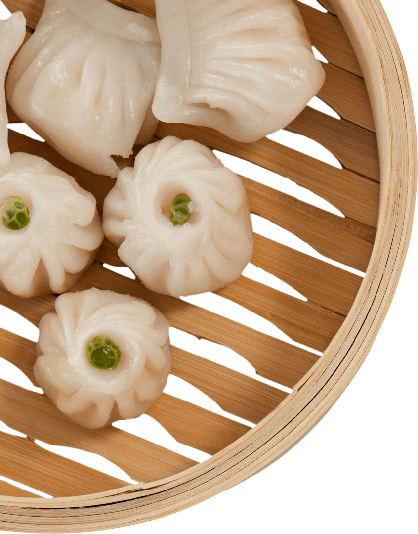 Close-up of Delicious Dumplings in Bamboo Steamer on Transparent Background