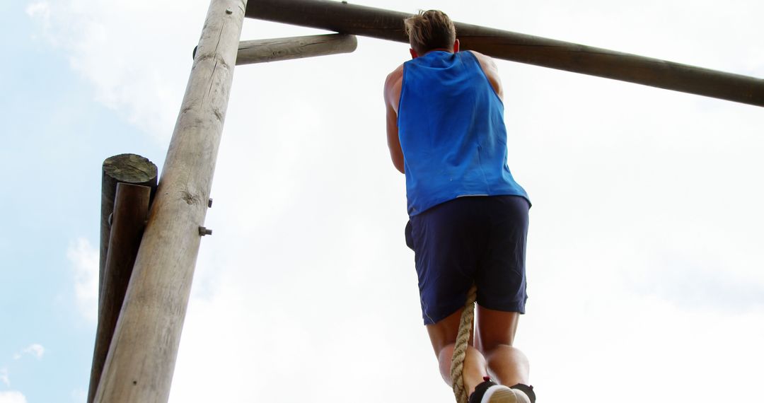 Man Climbing Rope Outdoors in Fitness Challenge - Free Images, Stock Photos and Pictures on Pikwizard.com