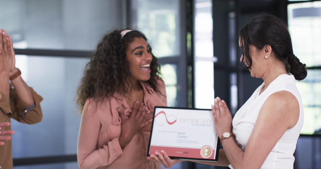 Diverse Colleagues Celebrating and Rewarding Team Members in Office