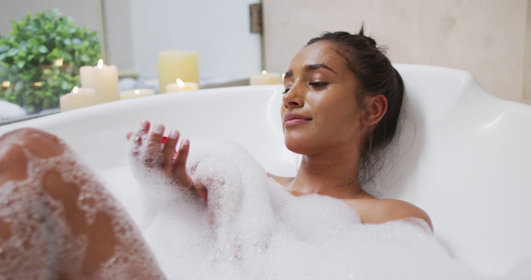 Woman Enjoying Relaxing Bubble Bath with Candles - Free Images, Stock Photos and Pictures on Pikwizard.com