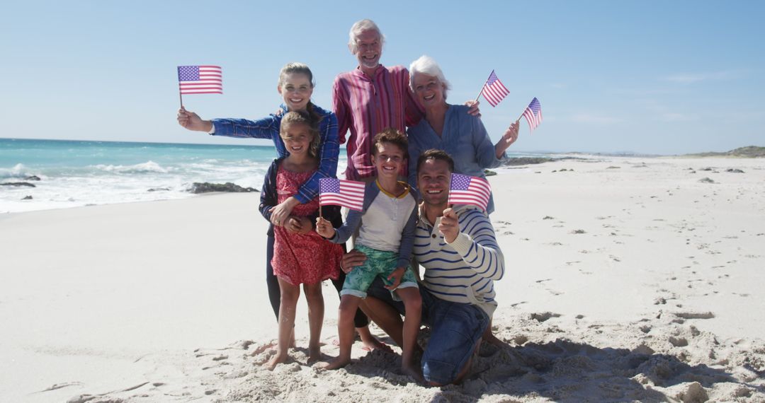 Happy Multigenerational Family Celebrating Independence Day on Beach - Free Images, Stock Photos and Pictures on Pikwizard.com