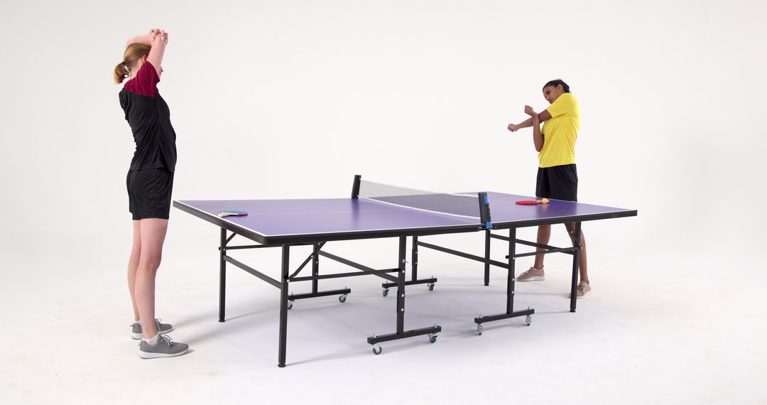 Female Table Tennis Players Stretching in Studio