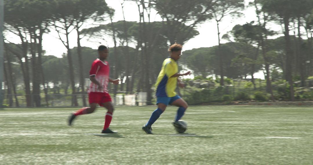 Two Soccer Players Compete Intensely During Competitive Match