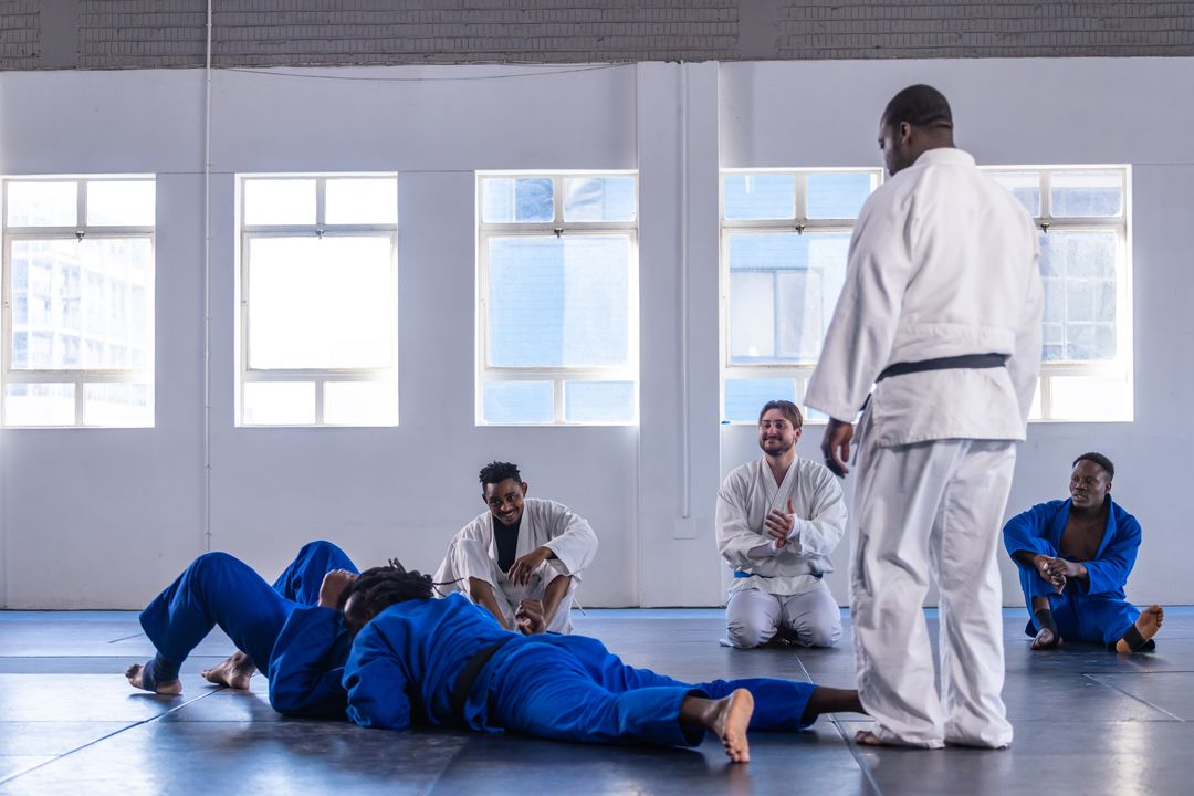 Diverse Martial Arts Class Practicing Sparring with Instructor