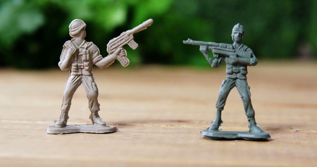 Close-Up of Plastic Toy Soldiers on Wooden Surface - Free Images, Stock Photos and Pictures on Pikwizard.com