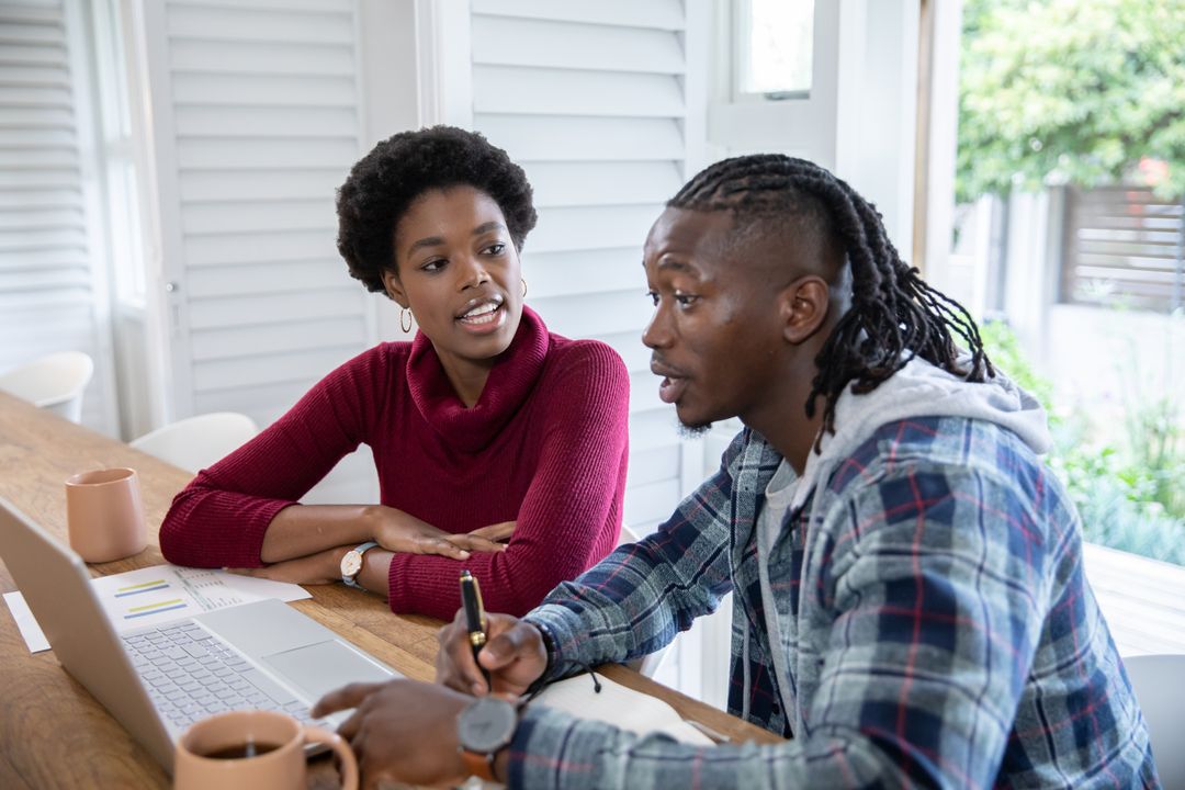 Professional Collaboration at Home over Laptop and Notes