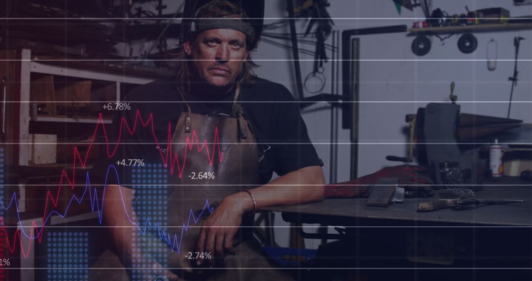 Caucasian Male Worker in Workshop with Graph Overlays