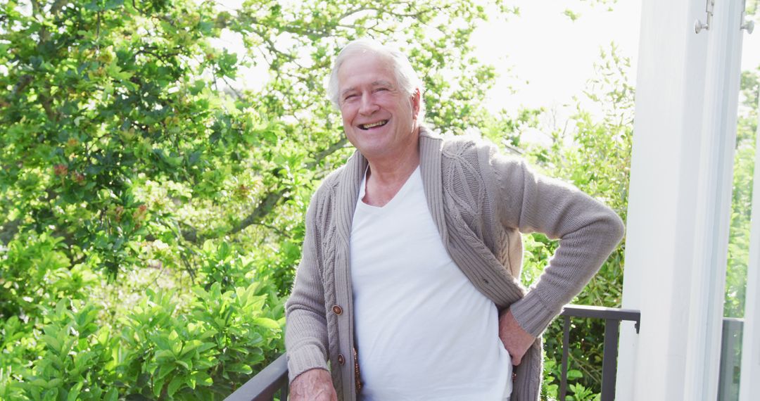 Elderly Man Enjoying Sunny Day on Balcony - Free Images, Stock Photos and Pictures on Pikwizard.com