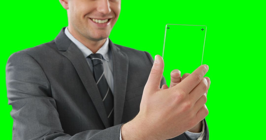 Businessman Holding Transparent Mockup Card with Green Screen - Free Images, Stock Photos and Pictures on Pikwizard.com