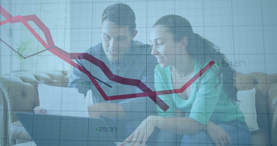 Caucasian Couple Analyzing Financial Data on Laptop