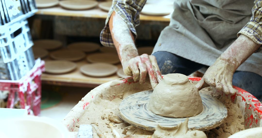 Potter's Hands Shaping Clay on Wheel - Free Images, Stock Photos and Pictures on Pikwizard.com