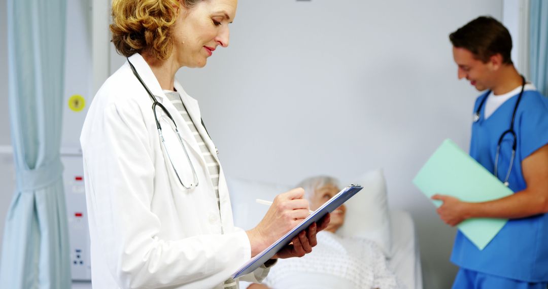 Medicine Professionals Reviewing Patient Information in Hospital Room - Free Images, Stock Photos and Pictures on Pikwizard.com