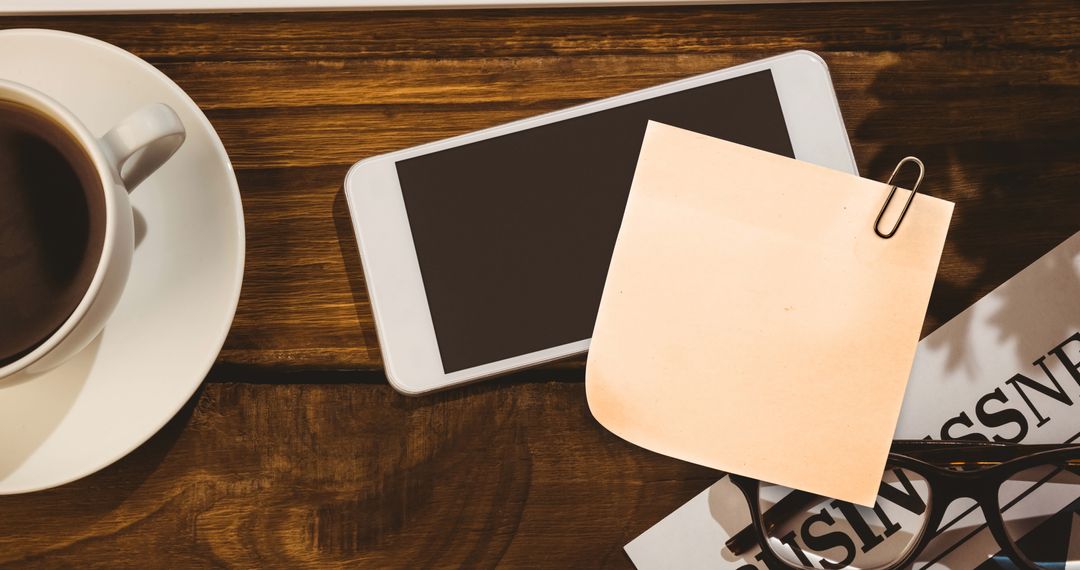 Organized Work Desk With Smartphone and Coffee