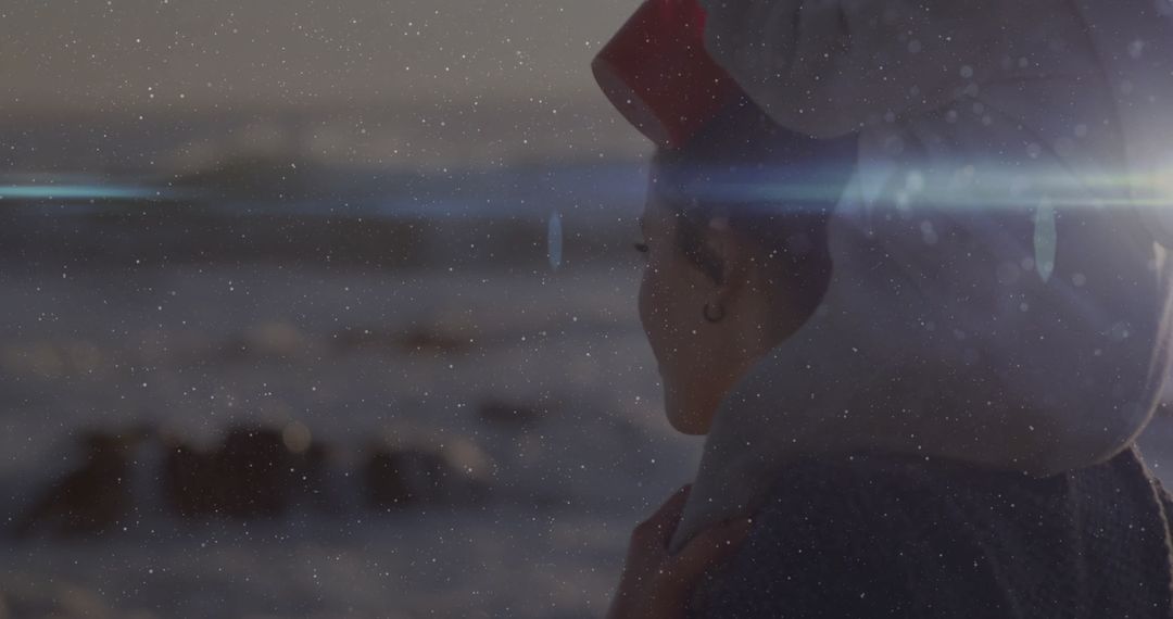Woman in Red Headband Reflects by Snowy Coast at Dusk