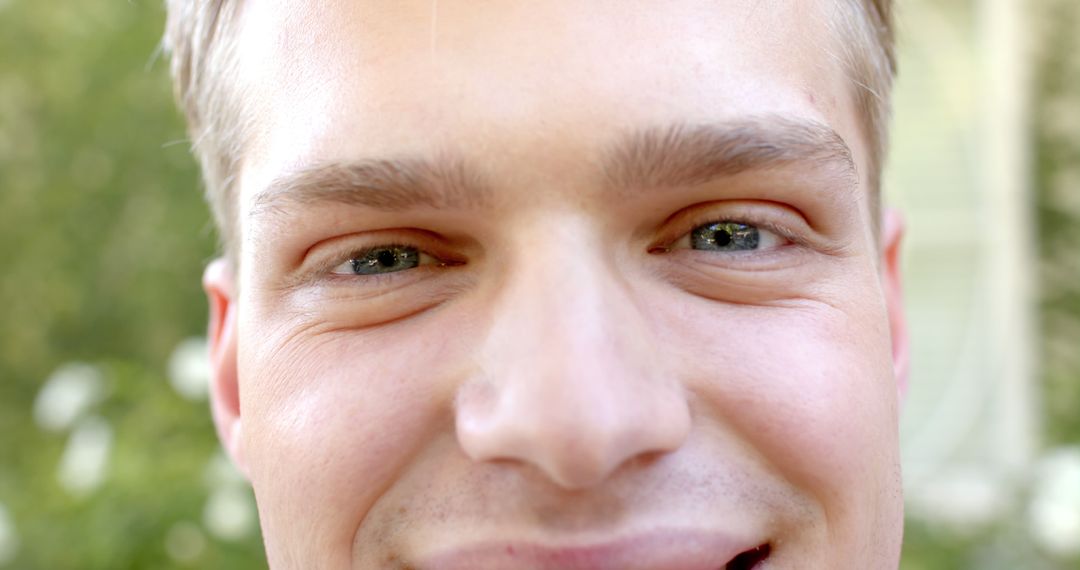 Close-up Portrait of Smiling Young Man Outdoors in Daylight - Free Images, Stock Photos and Pictures on Pikwizard.com