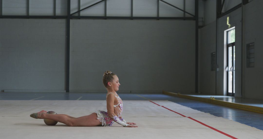 Young Rhythmic Gymnast Practicing in Empty Gymnasium - Free Images, Stock Photos and Pictures on Pikwizard.com