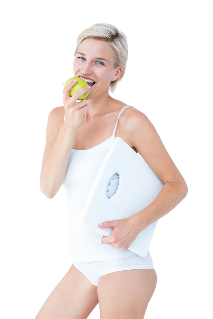 Healthy Woman Eating Green Apple While Holding Transparent Scales - Download Free Stock Images Pikwizard.com