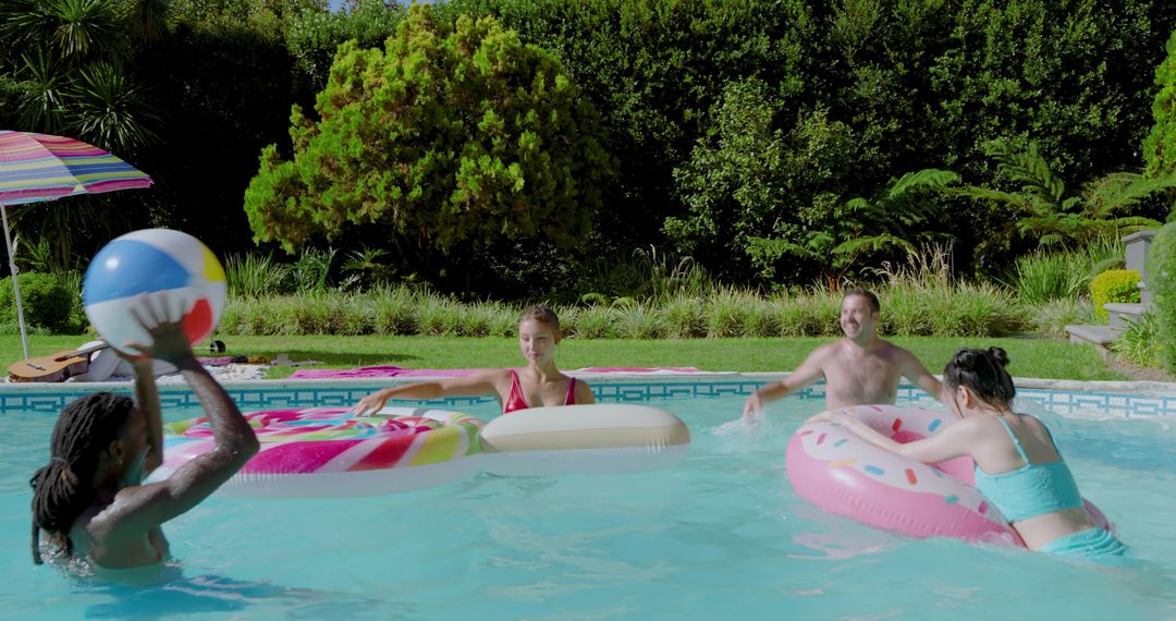 Friends Enjoying Summer Playtime in Backyard Pool with Inflatable Toys