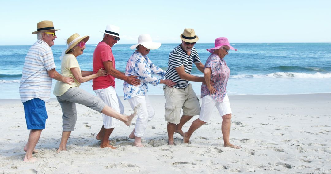 Senior friends dancing on the beach - Free Images, Stock Photos and Pictures on Pikwizard.com