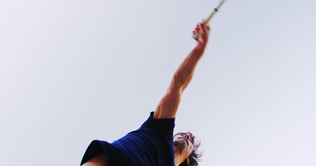 Low Angle View of Man Playing Tennis - Free Images, Stock Photos and Pictures on Pikwizard.com