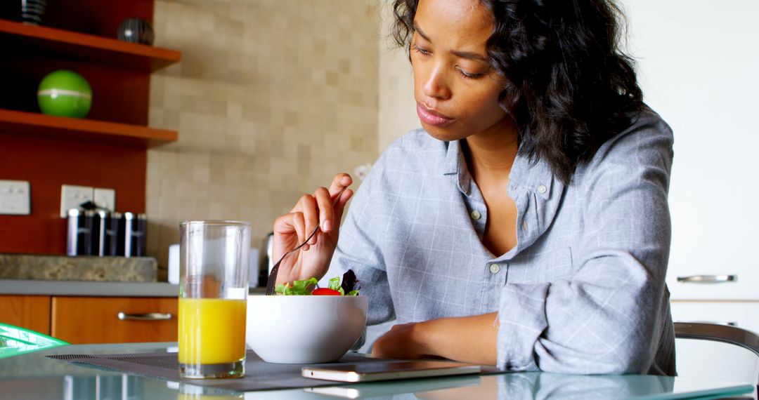 Woman Eating Healthy Salad and Juice for Breakfast at Home - Free Images, Stock Photos and Pictures on Pikwizard.com