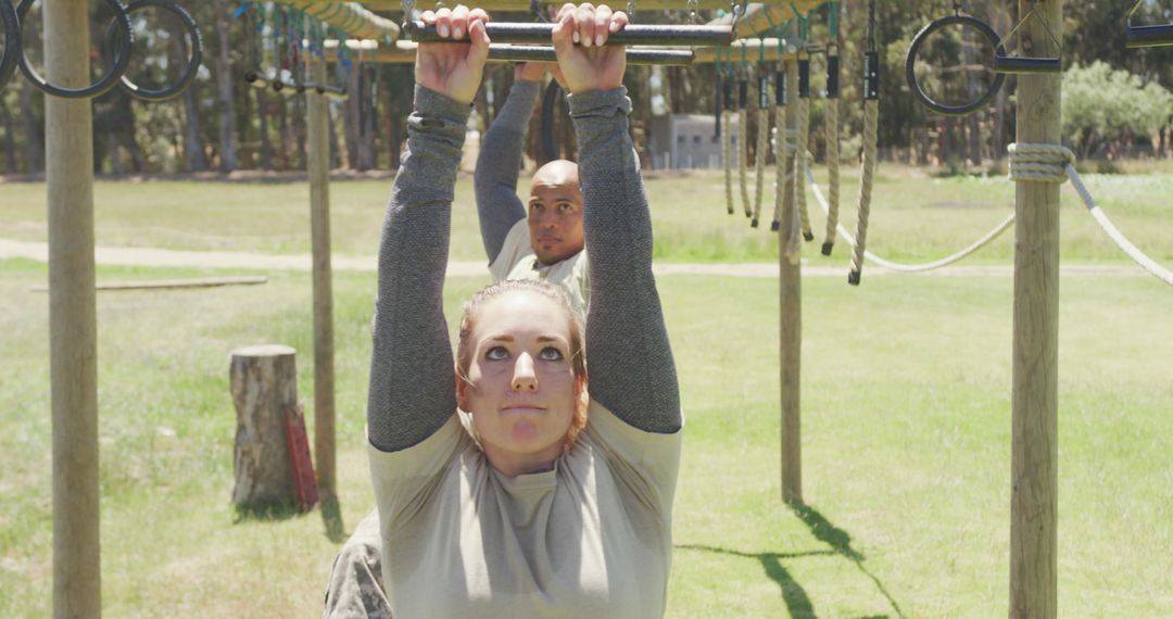 Soldiers Training on Outdoor Obstacle Course in Sunlight