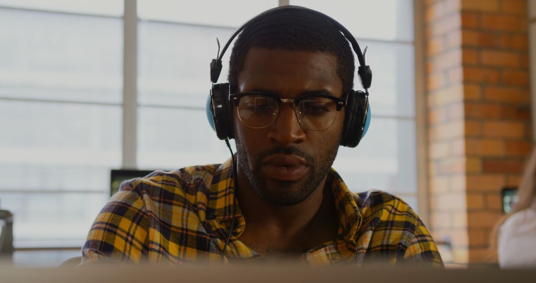 Focused African American Professional Working in Modern Office Environment