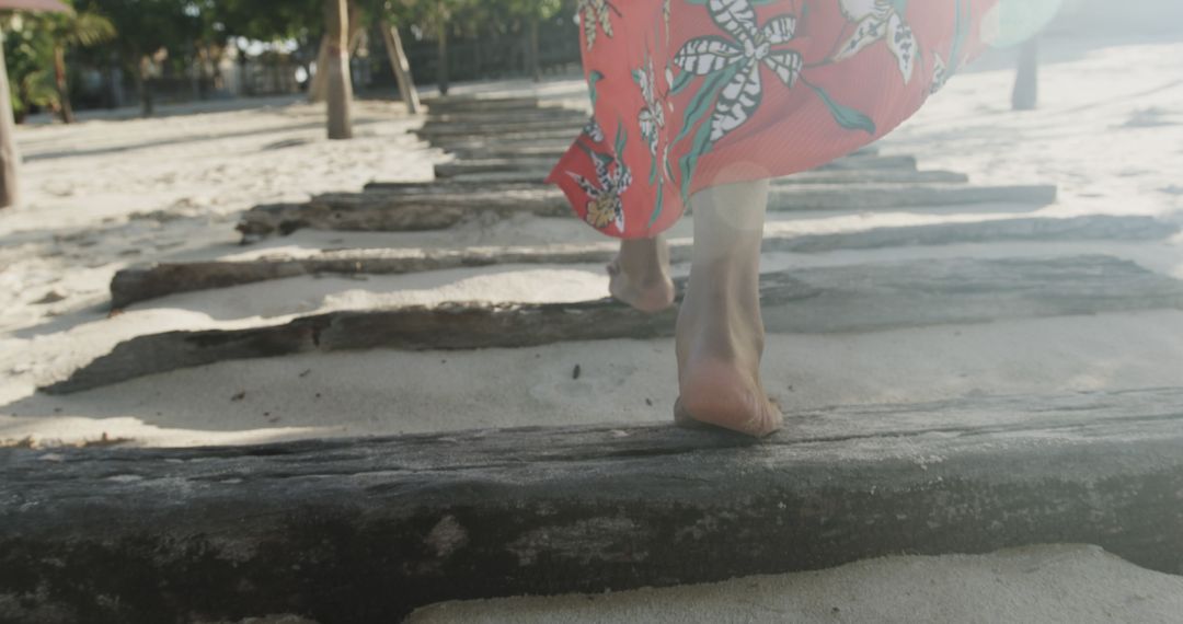 Woman Walking Barefoot on Sandy Beach Wooden Pathway - Free Images, Stock Photos and Pictures on Pikwizard.com