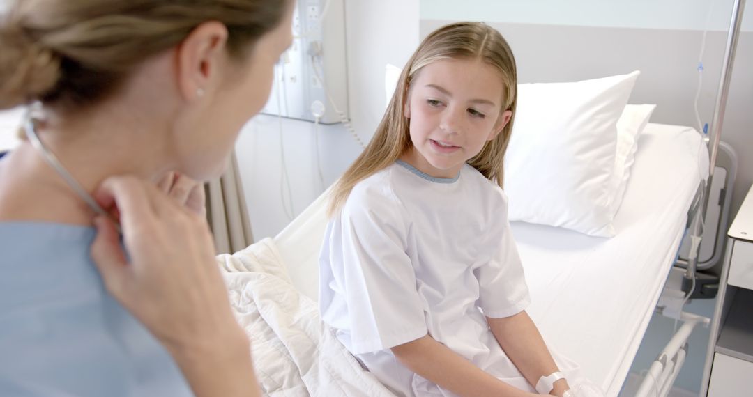 Doctor and Young Patient Communicating in Hospital Room - Free Images, Stock Photos and Pictures on Pikwizard.com