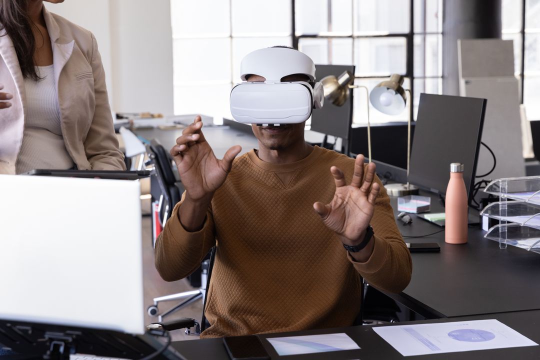 Colleagues Using Virtual Reality Technology in Modern Office