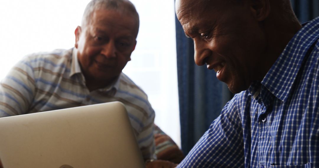 Senior African American Men Collaborating on Laptop - Free Images, Stock Photos and Pictures on Pikwizard.com