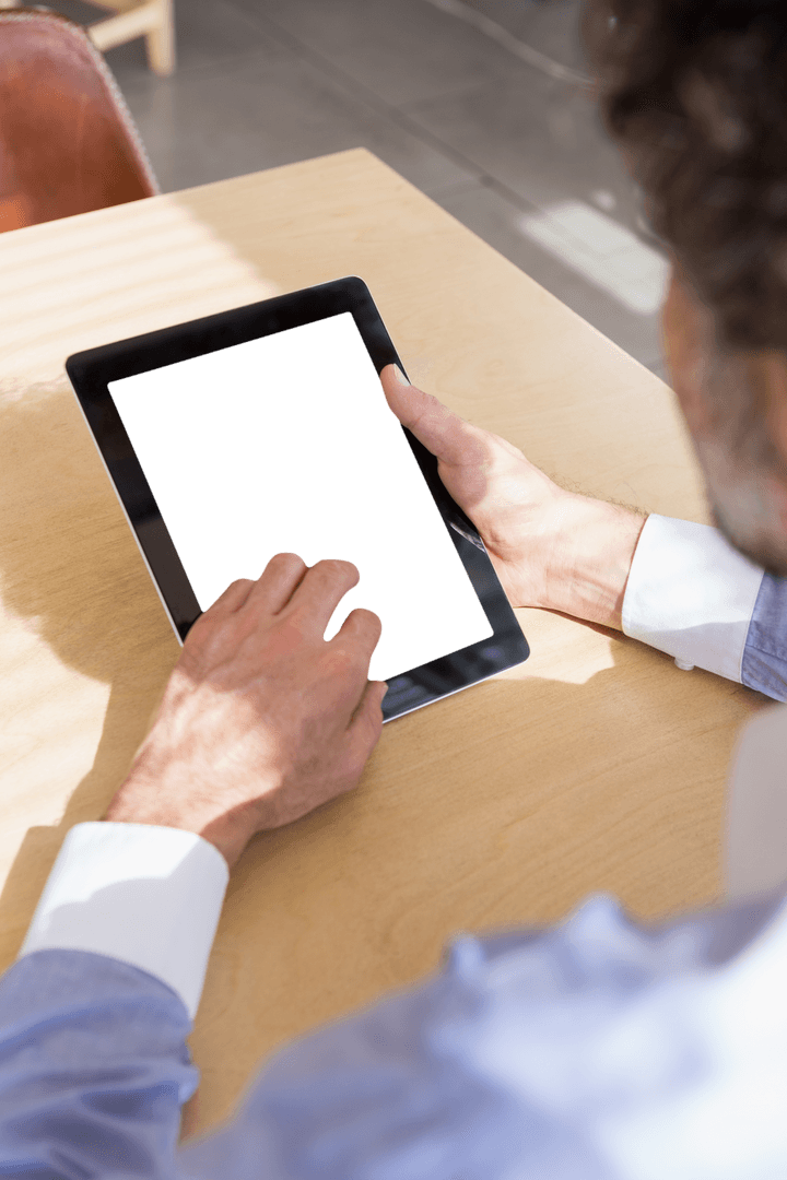 High Angle View of Man Using Transparent Digital Tablet Inetior