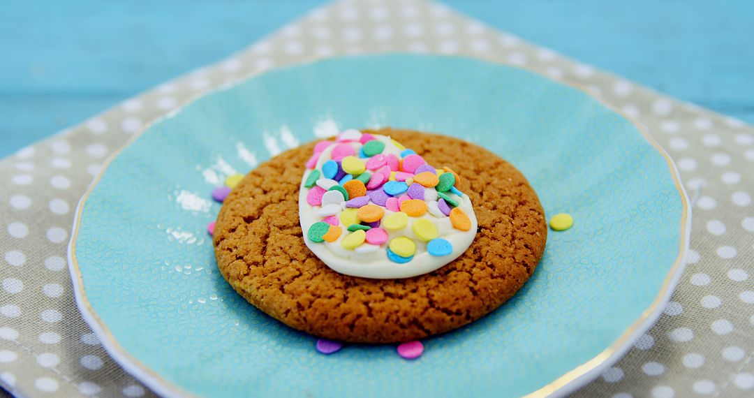 Colorful Decorated Cookie with Polka Dot Napkin on Blue Background - Free Images, Stock Photos and Pictures on Pikwizard.com