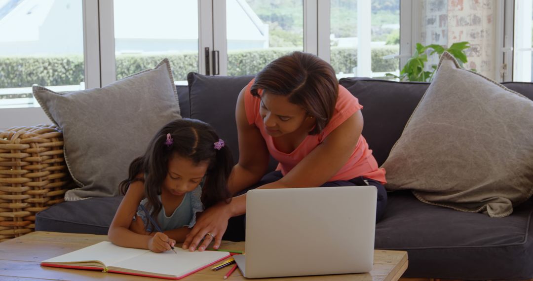 Mother Helping Child with Homework in Cozy Living Room - Free Images, Stock Photos and Pictures on Pikwizard.com