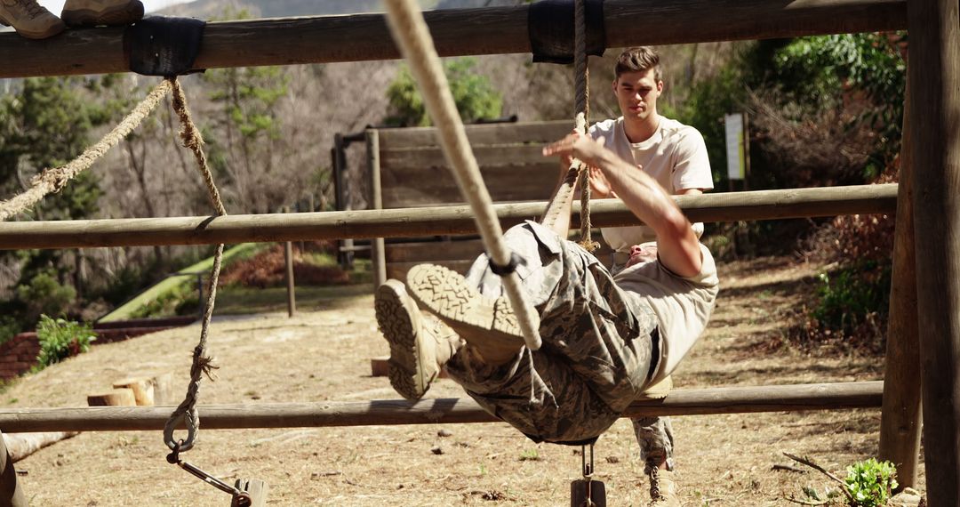 Male soldiers training on obstacle course in forest - Free Images, Stock Photos and Pictures on Pikwizard.com