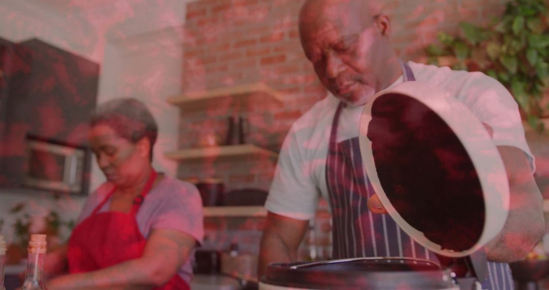 Senior Couple Enjoys Cooking Together in Rustic Kitchen