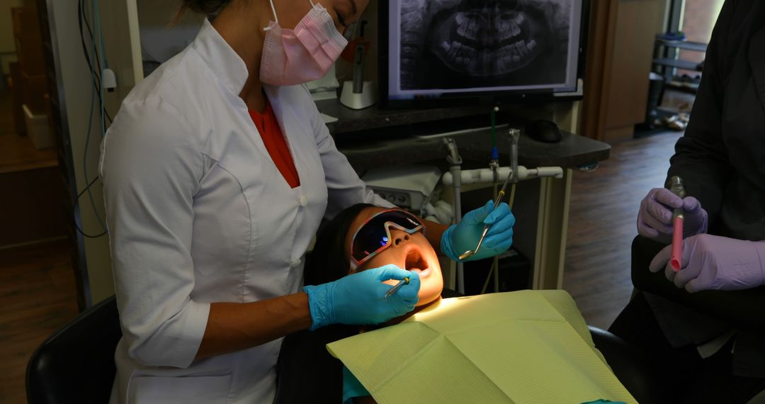 Female Dentist Examining Child Patient in Dental Clinic - Free Images, Stock Photos and Pictures on Pikwizard.com