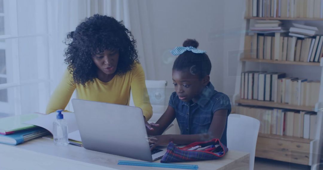 Mother and Daughter Using Laptop for Homework Education