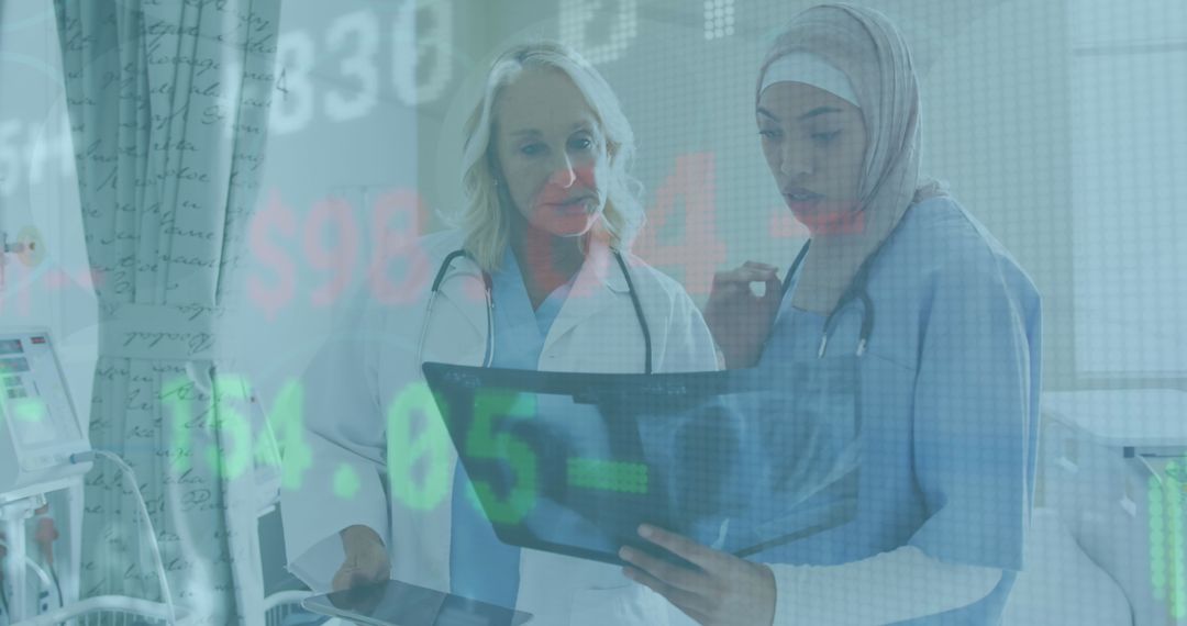 Female Healthcare Professionals Analyzing X-Ray and Discussing Data