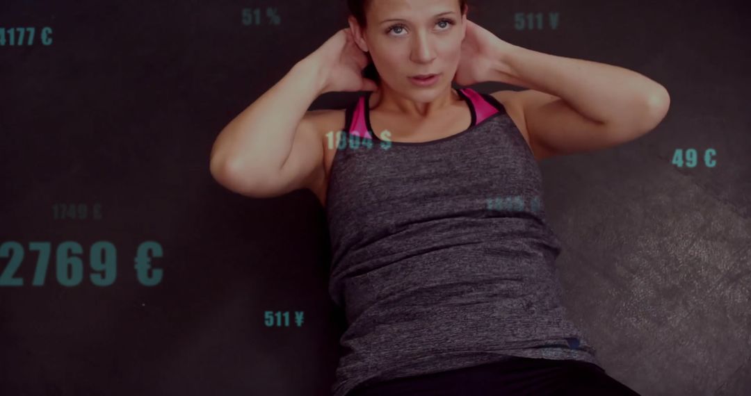 Person Performing Sit-Ups with Futuristic Currency Overlay