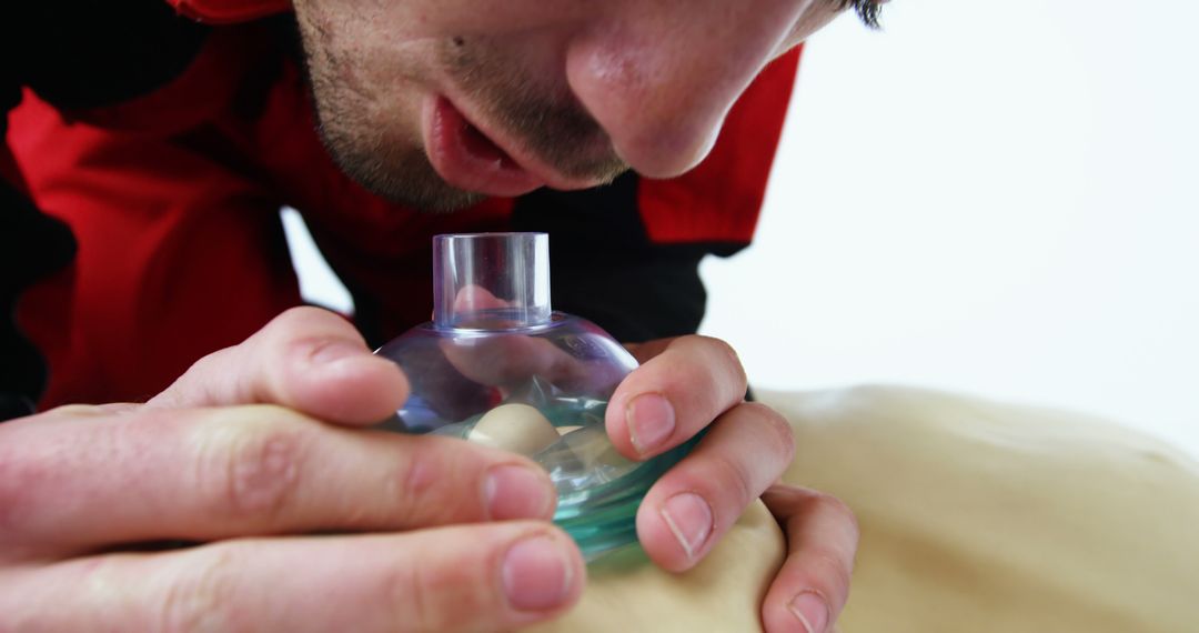 Emergency Medical Technician Administering CPR with Rescue Mask - Free Images, Stock Photos and Pictures on Pikwizard.com