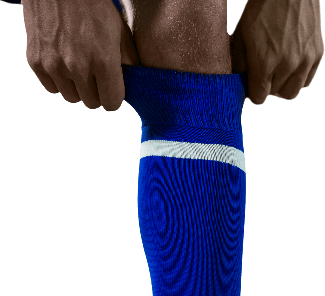 Transparent Focus on Player Adjusting Blue Football Socks