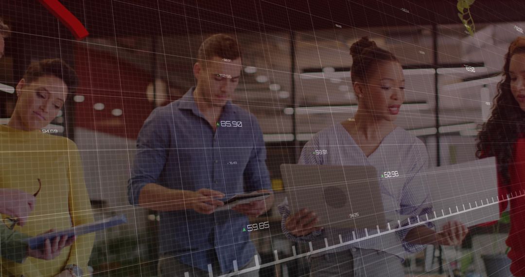 Diverse Team Reviewing Digital Charts in Modern Office