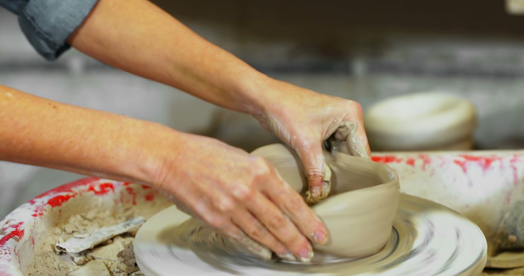 Hands Shaping Clay on Pottery Wheel in Art Studio - Free Images, Stock Photos and Pictures on Pikwizard.com